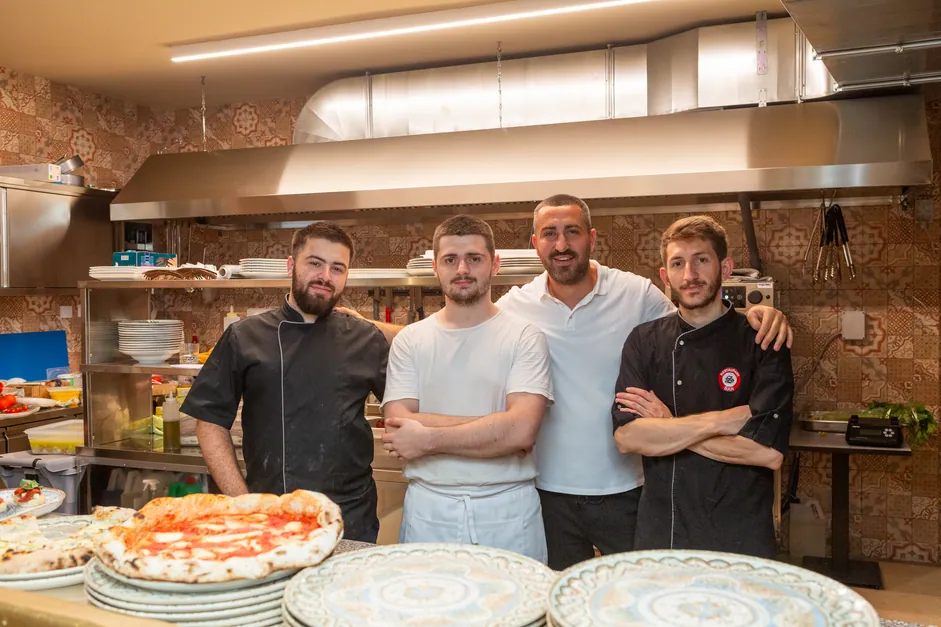 The kitchen team behind the pass