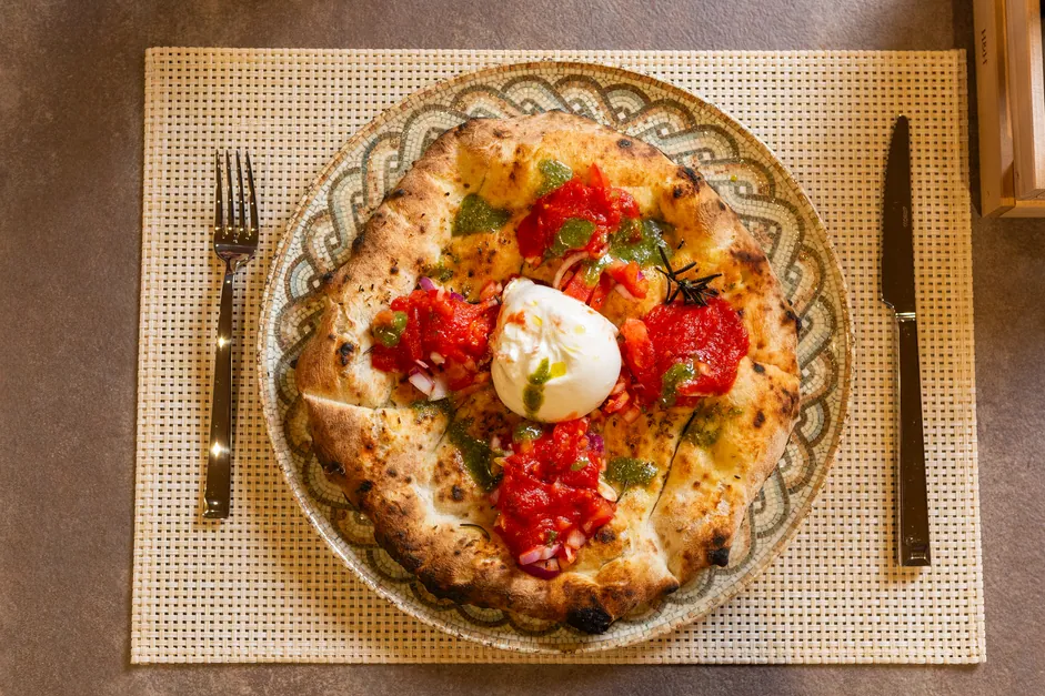 Pizza set down at the table